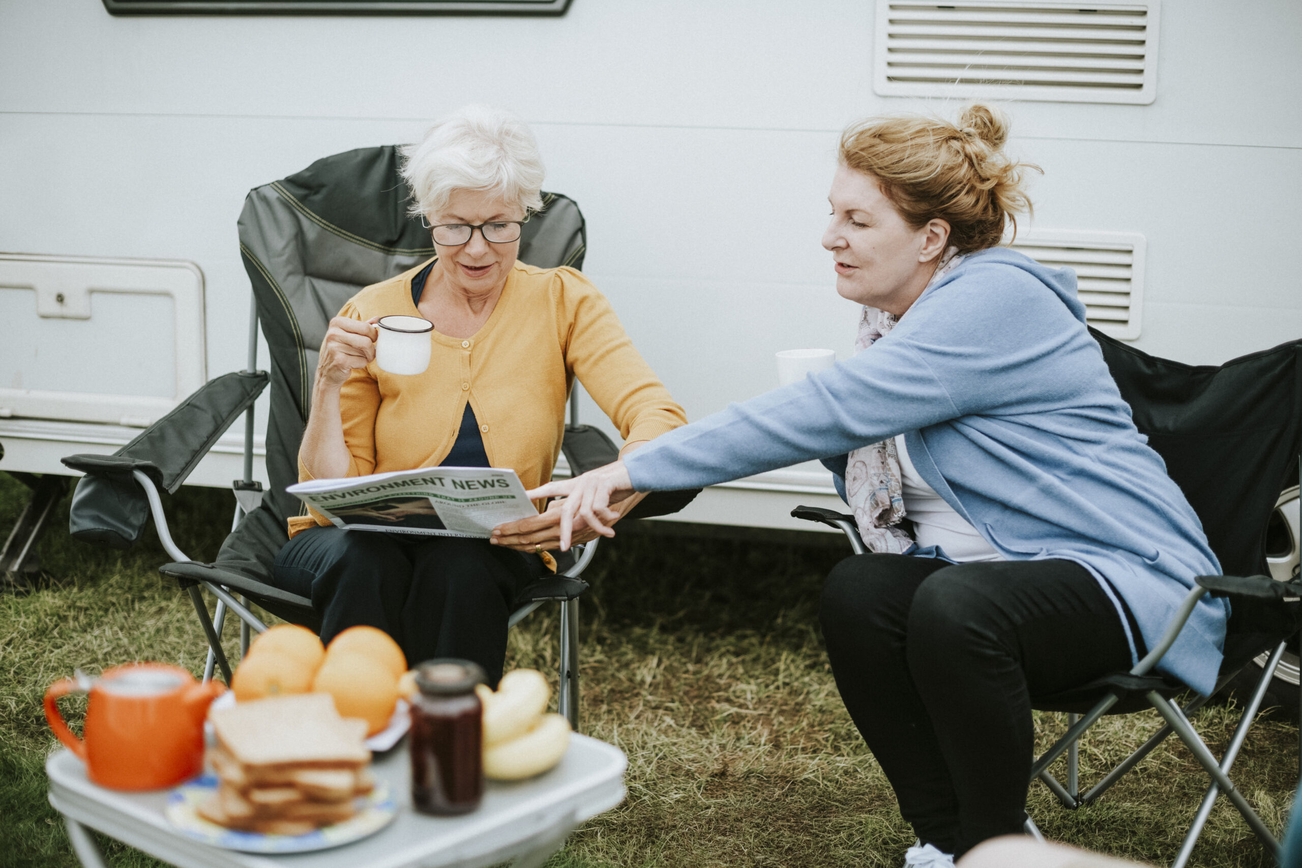 Senior women reading the newspaper