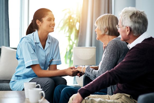 Nurse helping care for couple
